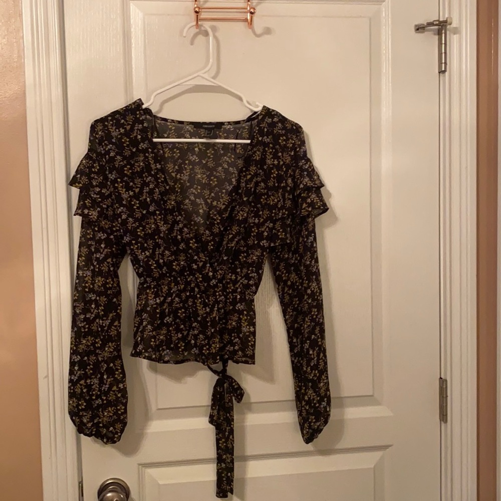 Sheer material long sleeved shirt, not see through.